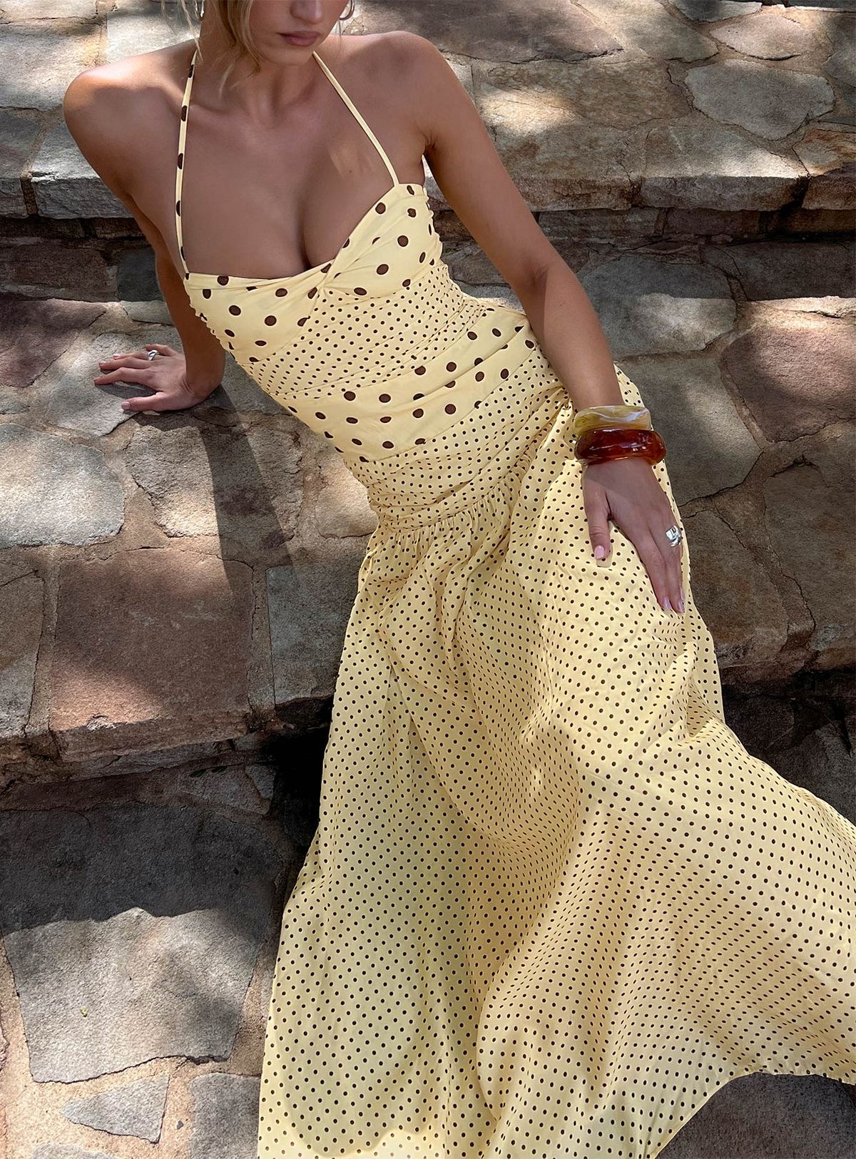 Yellow polka-dot maxi dress styled for summer