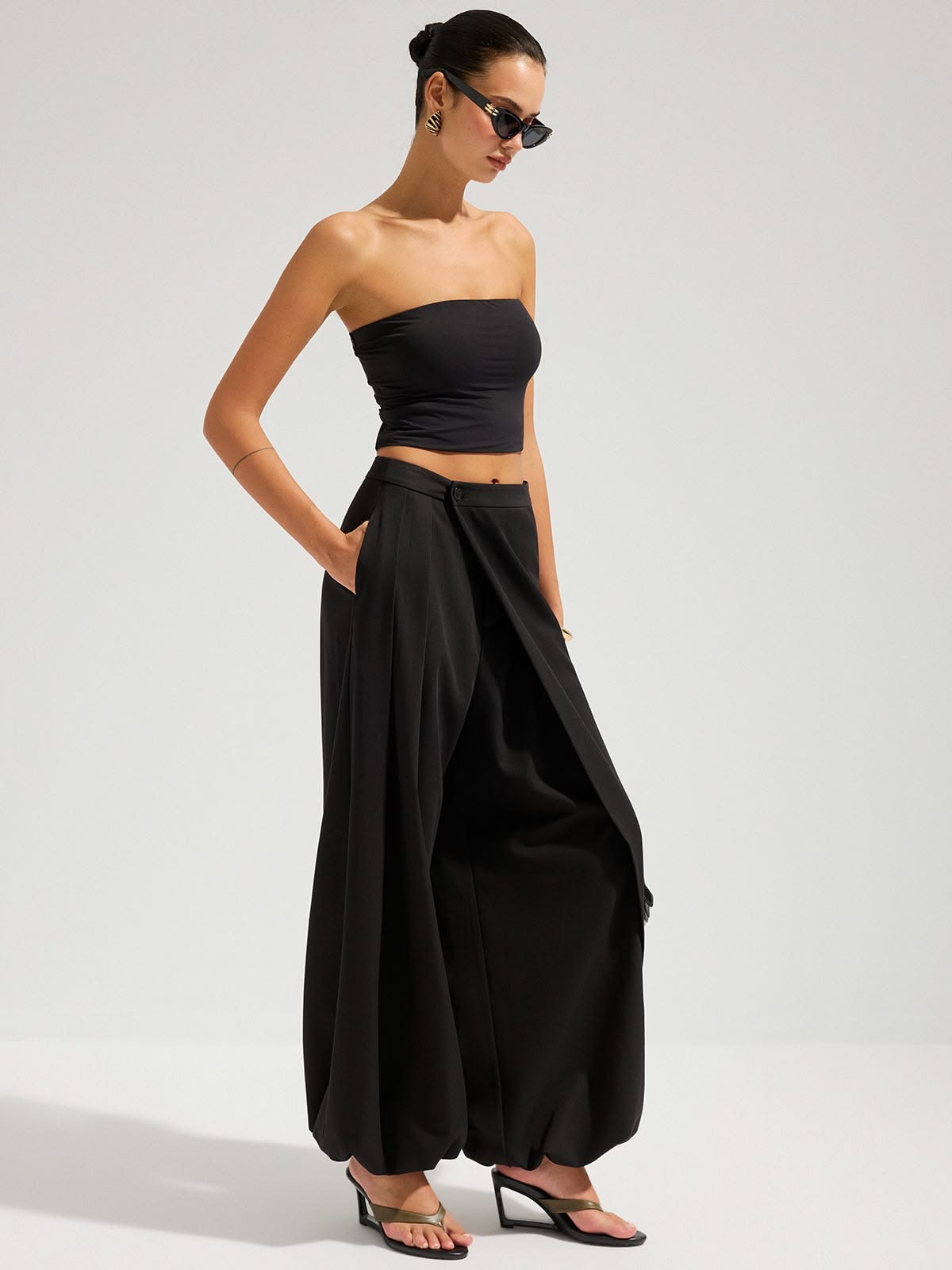 Voluminous black exaggerated-hem trousers with cropped top