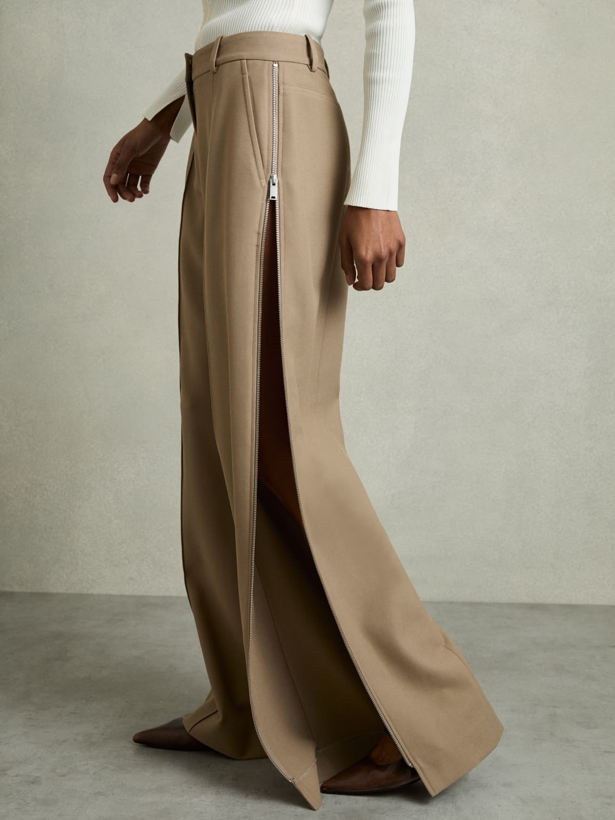Wide-leg zip-detail trousers with exaggerated hemline